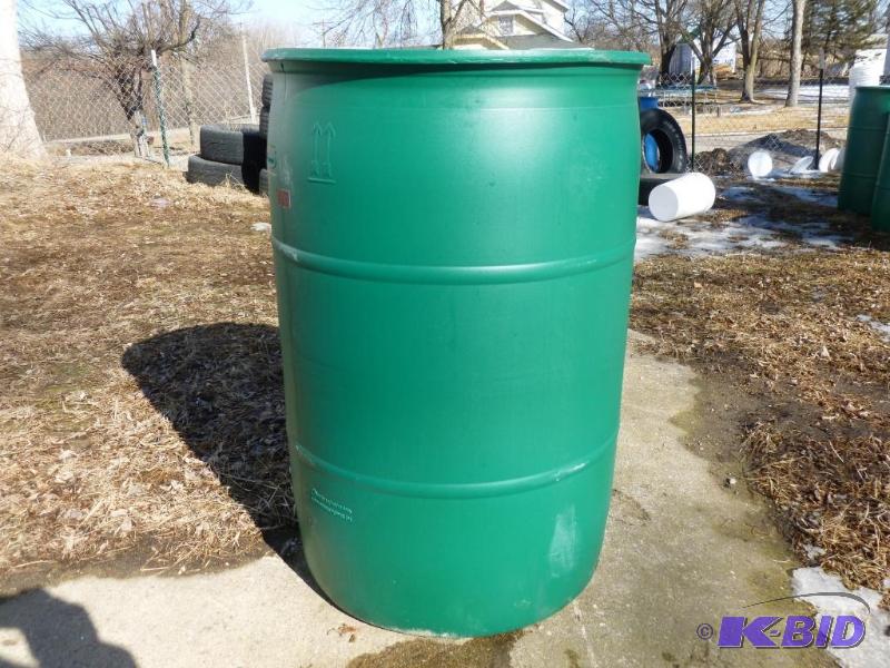 lot 134 image: Large 55 gallon plastic drum, comes with two ...