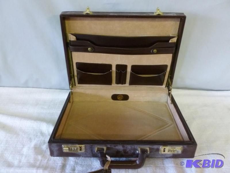 lot 62 image: Genuine leather and suede lined briefcase....