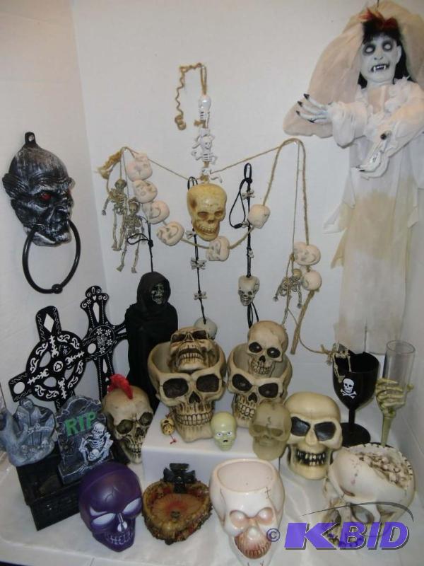 lot 15 image: Halloween SKULLS  Collection of decorative Skulls & a Vampire Bride
