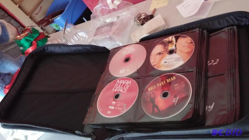 LARGE LOT of DVDs as shown with DVD Folder. ...