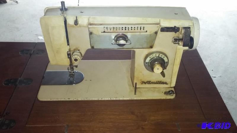 Vintage Hamilton Sewing Machine in cabinet. A...