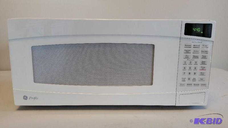 lot 9 image: GE White Counter top Microwave.  Used, Tested, Clean.  Works