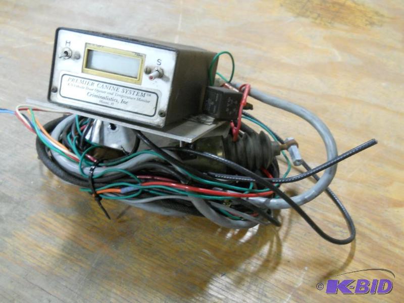 lot 8 image: Criminalistic K9 System. Police Car Door Opener and Temperature Monitor.
