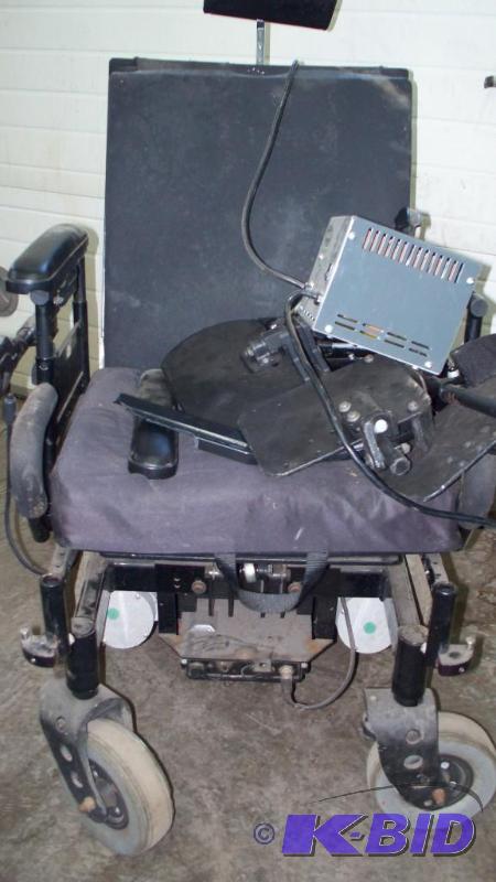 lot 6 image: Power chair Invacare storm series with charge...