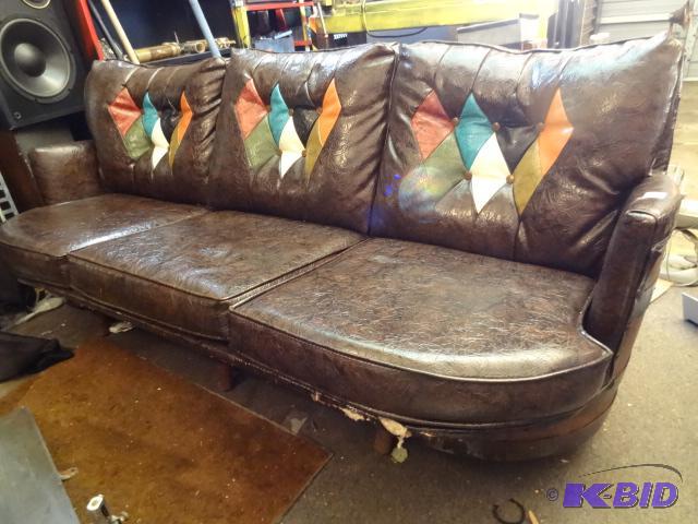 lot 34 image: Vintage Couch. Has Whiskey Barrel Sides and B...