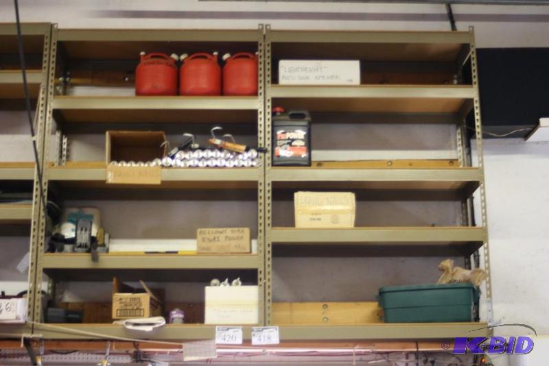 lot 418 image: Contents of Shelving Units Including Plastic Jugs wCaps Liquid Nails Caulk Guns And More.