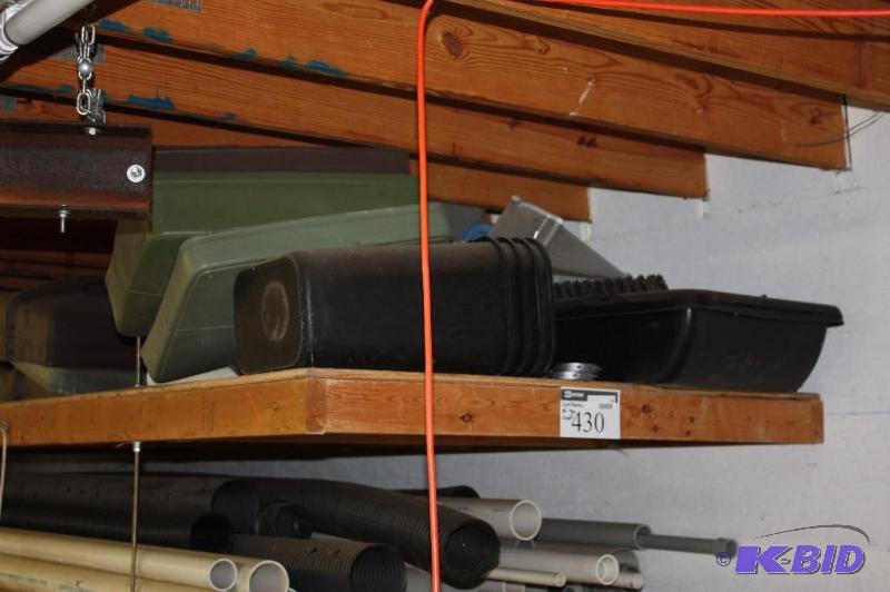 lot 430 image: Contents of Shelf Including Plastic Lids And More. Does Not Include Orange Jet Hoist in Photo.