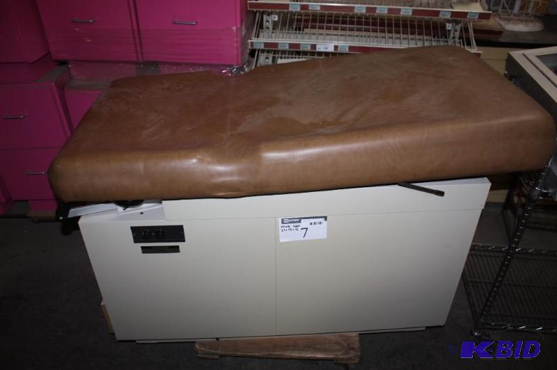 lot 7 image: Hamilton E Series Exam Table wStorage Drawers & Padded Rests Fold-Out Foot Rest 27 x 54 x 36.
