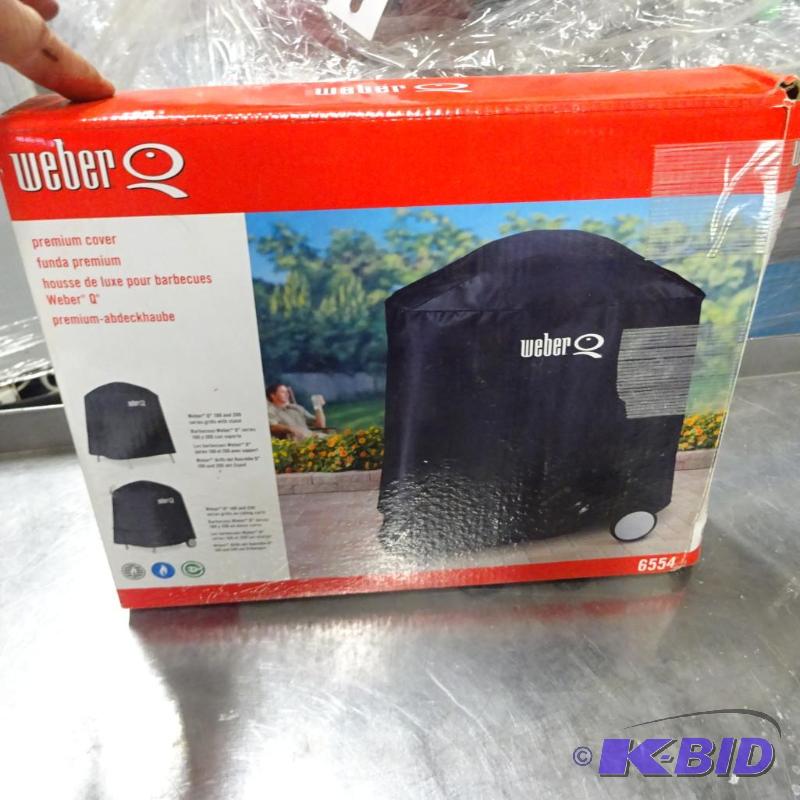 lot 105 image: New Weber brand premium grill cover model 655...