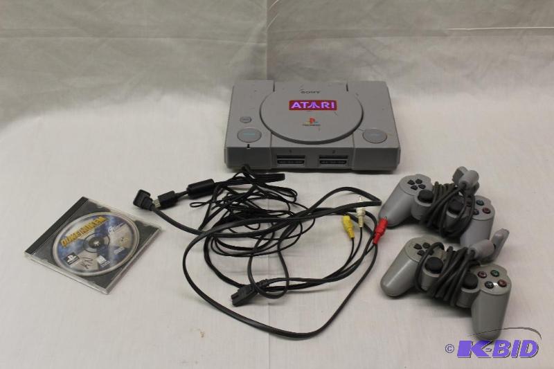 lot 129 image: Sony Playstation   Complete with a game&...