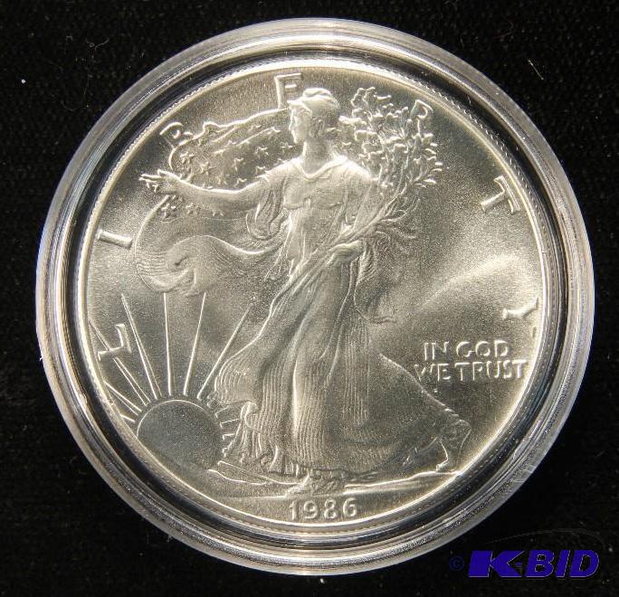 lot 11 image: 1986 AMERICAN SILVER EAGLE 1 TROY OZ. .999 FINE SILVER US DOLLAR COIN IN AIRTIGHT HOLDER