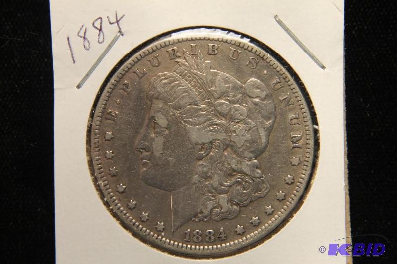 lot 14 image: 1884 MORGAN SILVER DOLLAR VF