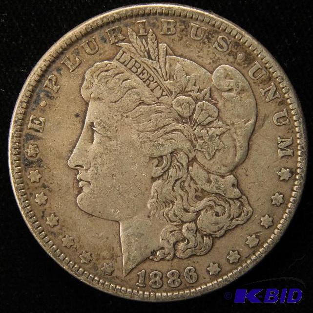 lot 32 image: 1886 MORGAN DOLLAR VF