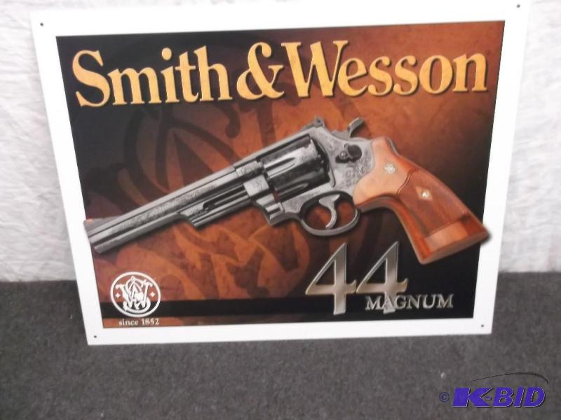 Collectable metal Smith &amp Wesson sign mea...