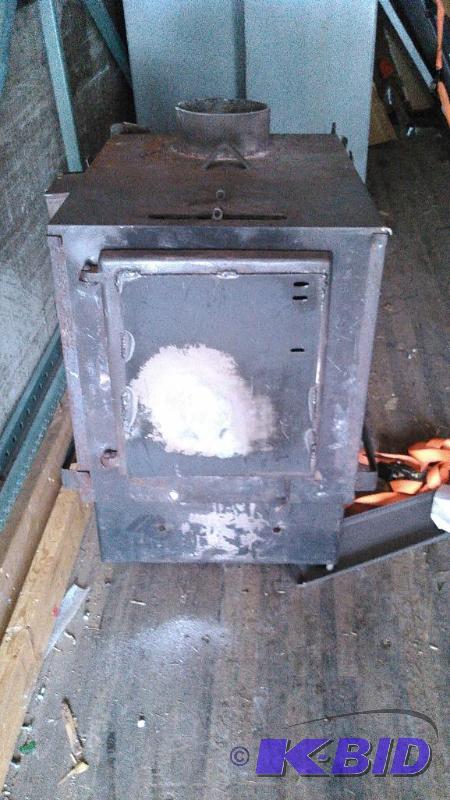 lot 102 image: Wood stove. Just removed from a garage. Works...