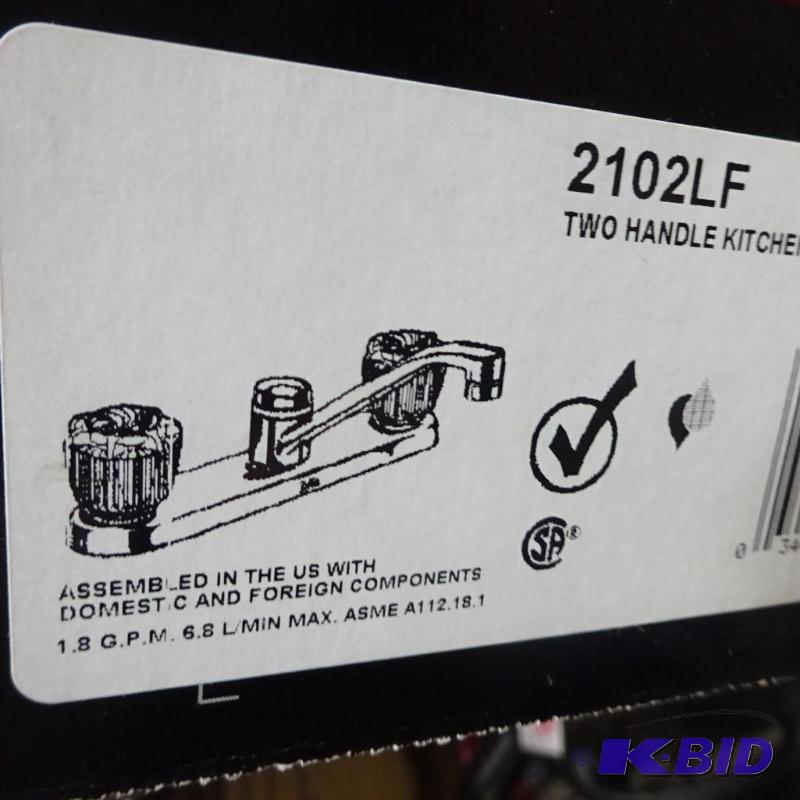 lot 136 image: New Delta brand 2 handle kitchen faucet. Mode...