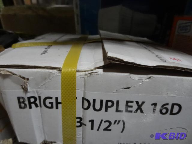 lot 41 image: New box of bright duplex 16 d nails. 3-12 in...
