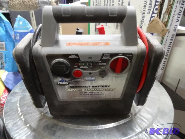 lot 53 image: Used Peak brand compact battery jump starting...