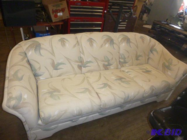 lot 26 image: Living Room Couch Has some tears....