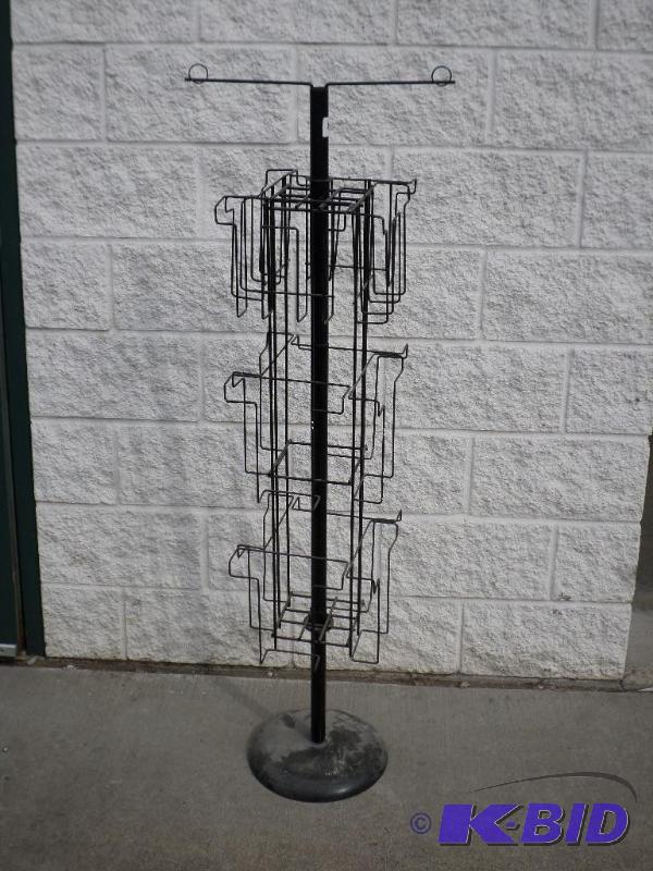 lot 46 image: 12-Place Swivel Display Rack With Weighted St...