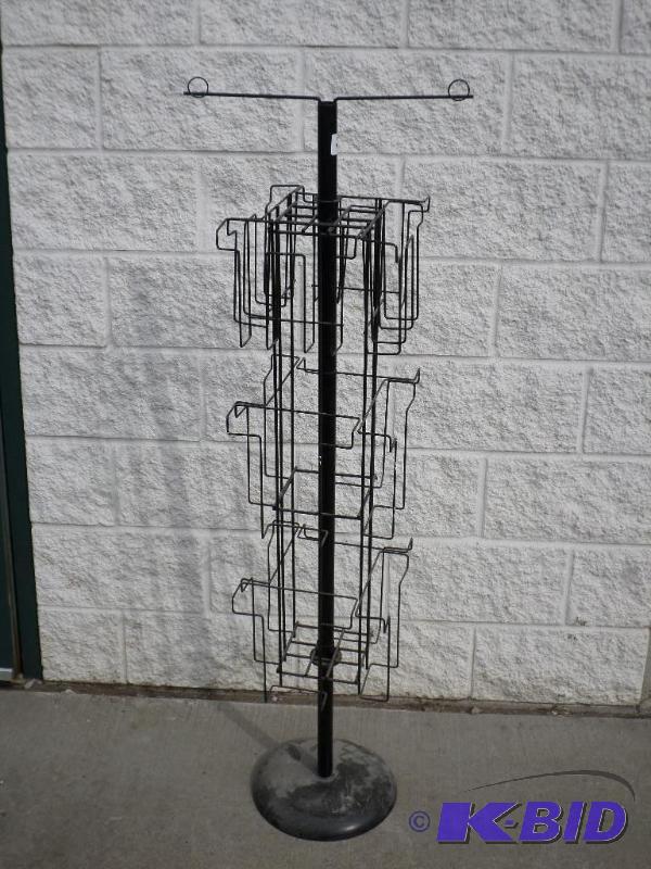 lot 47 image: 12-Place Swivel Display Rack With Weighted St...