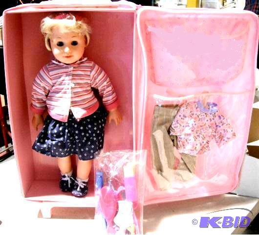lot 111 image: 17.5" Doll in Pink Carrier - Carrier has...