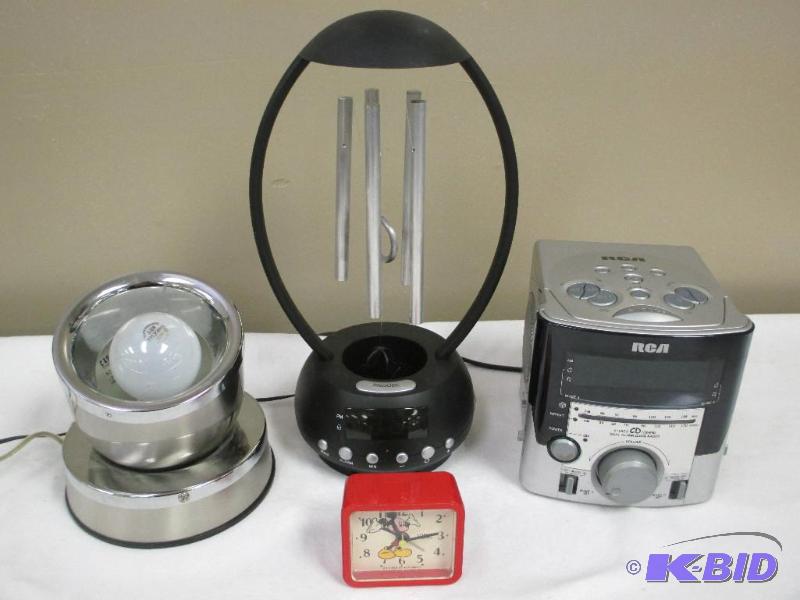 lot 00028 image: lot of three alarms clocks and a spot light