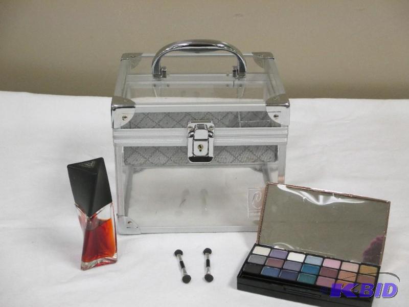 lot 26 image: Lot of cosmetic case, eye shadow and Guess fragrance