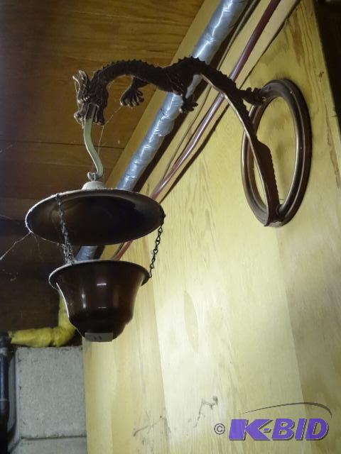 lot 11 image: Plastic Copper Colored Dragon Plant Hanger. A...