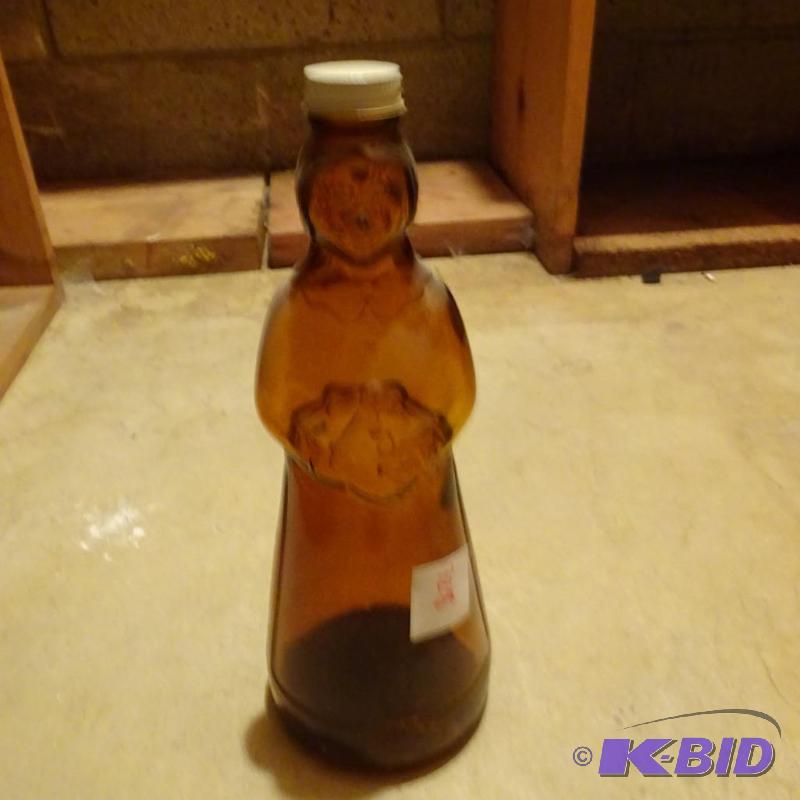 lot 328 image: Vintage Mrs Butter Worth Glass Bottle...