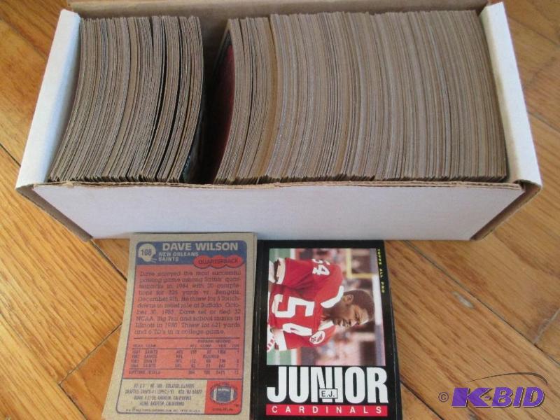 lot 19 image: Box of 1985 Topps football assorted sports ca...