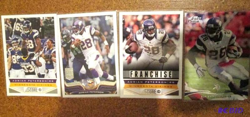 lot 8 image: 4 2013 Topps and Score Adrian Peterson sports...