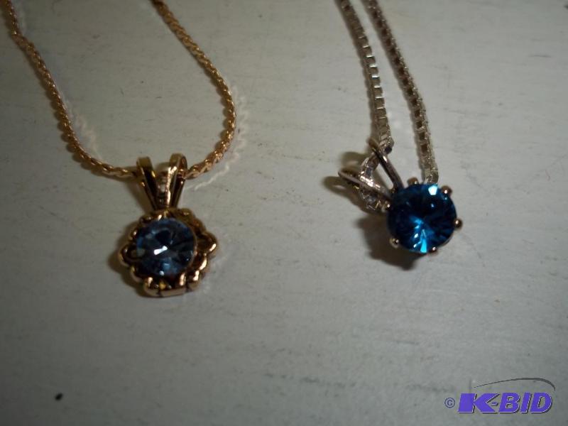 lot 94 image: Pair of Chain Necklaces with blue stones...