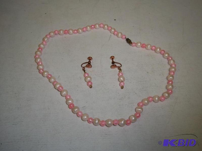 lot 97 image: Pink Plastic Pearl Necklace and Earrings...
