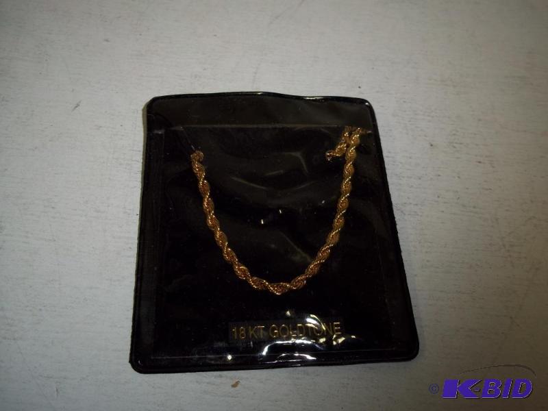 lot 98 image: Gold Tone Twisted Bracklet...