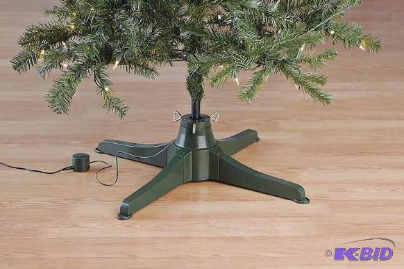 lot 33 image: alcove Musical Rotating Tree Stand.  New in box.  Tested rotates and plays christmas music.