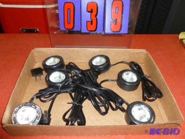 Flat of under the counter puck lights. As sho...