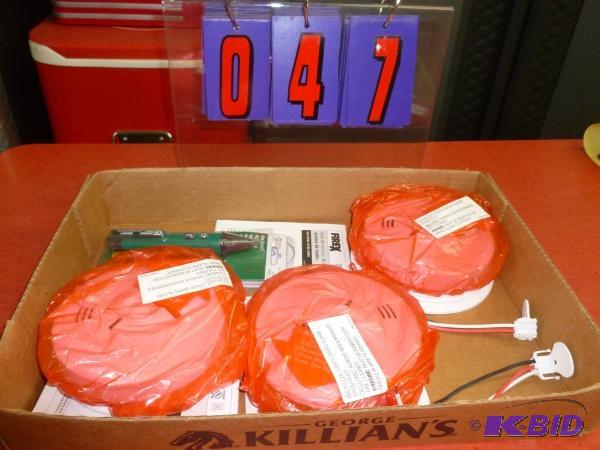 Flat of 110 volt smoke detectors and misc. As...