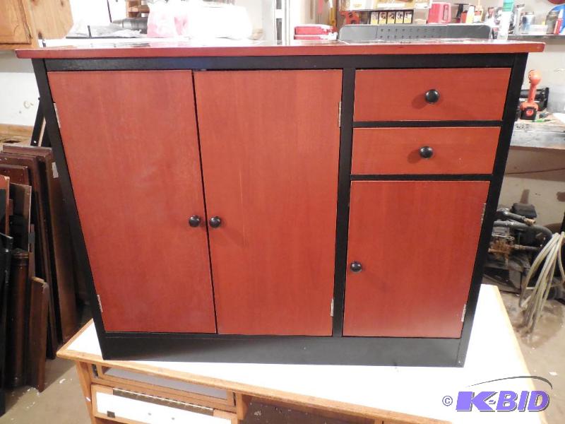 lot 10 image: New Ashley Furniture Kitchen Storage Cabinet
