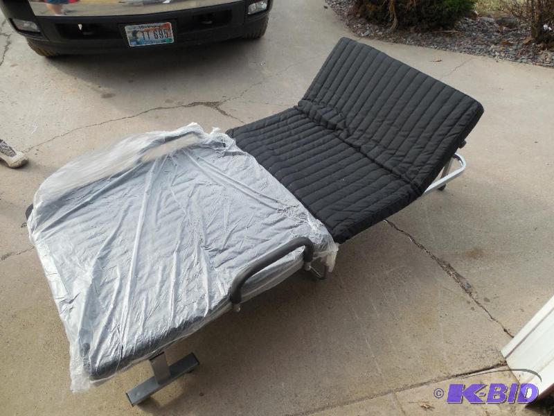lot 36 image: Compact Folding Rollaway BedLoveseat