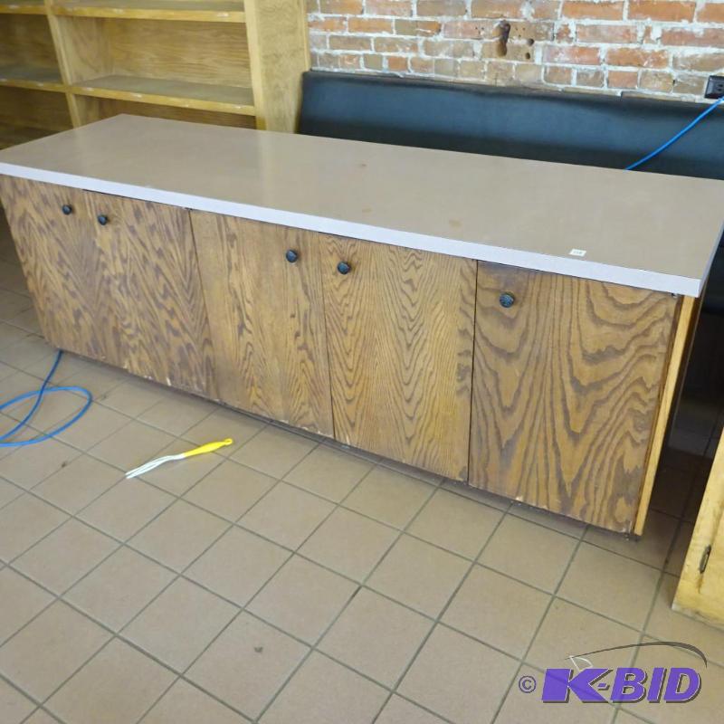 lot 148 image: Wood Cabinet with Laminate Top. 86 X 26 X 30....