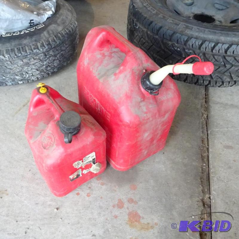lot 238 image: 1- 5 gal. and 1 - 2 12 gal Gas Cans...