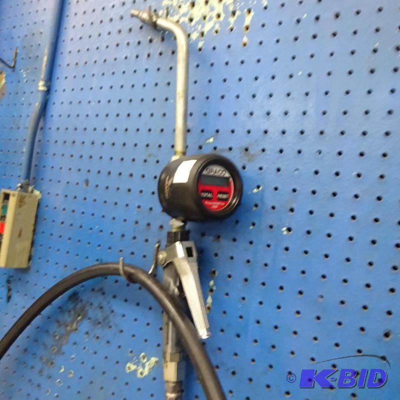 lot 107 image: Graco Metered Oil Dispenser with Hose...