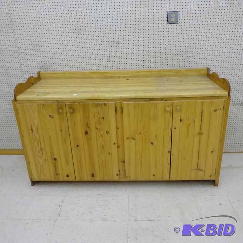 lot 83 image: Wood Cabinet 4 Doors Laminate Top. Screwed to...