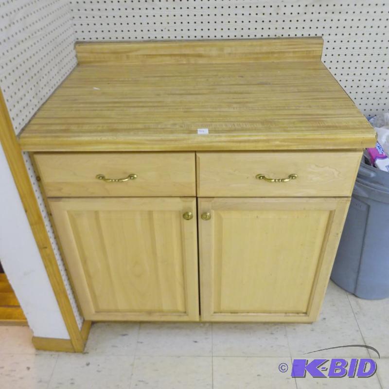 lot 84 image: Wood Cabinet 2 Door laminate Top. Screwed to ...