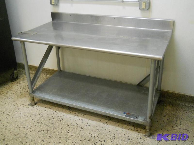 5 Eagle Stainless Steel Table with Backsplash and Undershelf.
