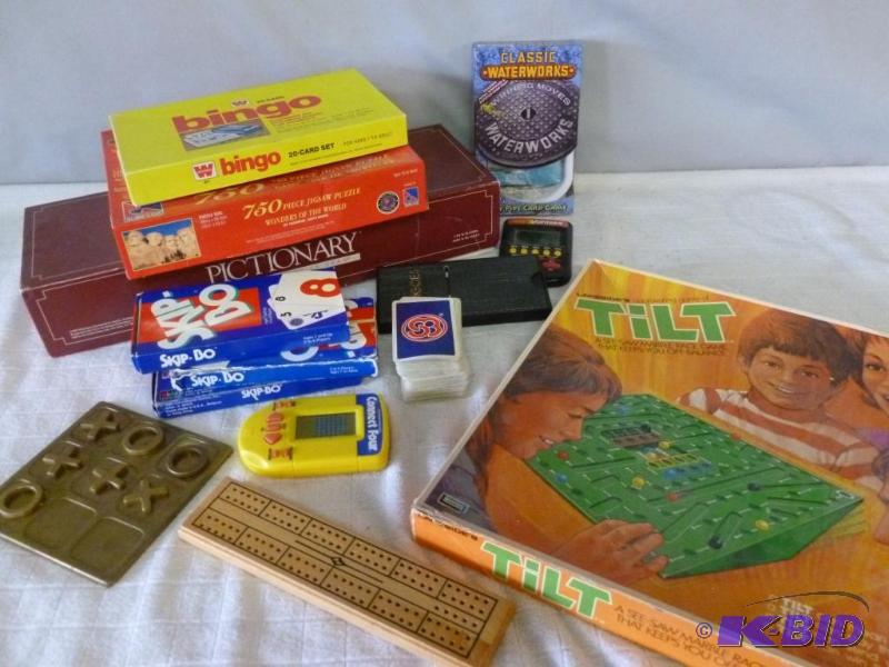 lot 100 image: Large lot of games that includes a vintage br...