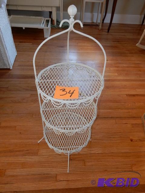 Plant or accessory stand.. Metal with draped design on sides..