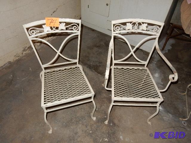 2 Wrought Iron Chairs.. 1 with arms, 1 without arms.  Very solid..