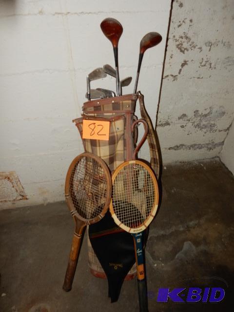 Old golf bag and womens clubs.. 2 wooden tennis racquets.